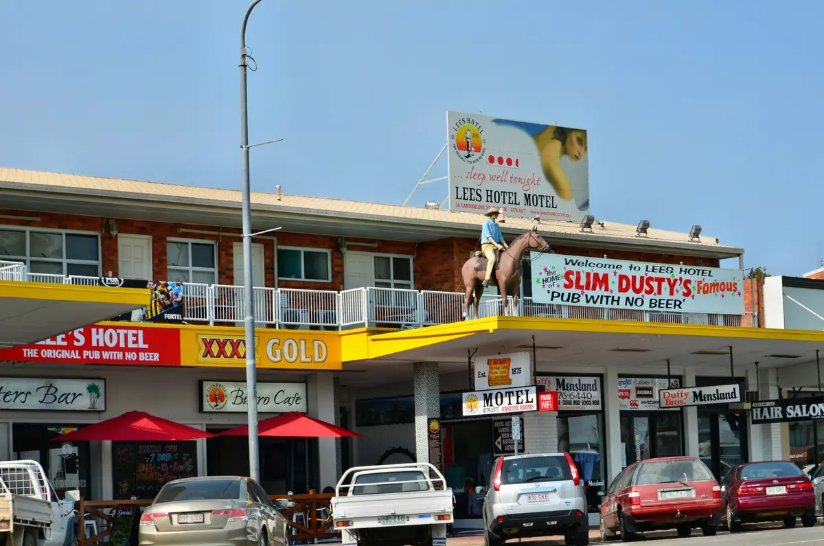 Lees Hotel in Ingham, with a life-size horse and rider on the awning and a banner reading Slim Dusty's famous Pub With No Beer